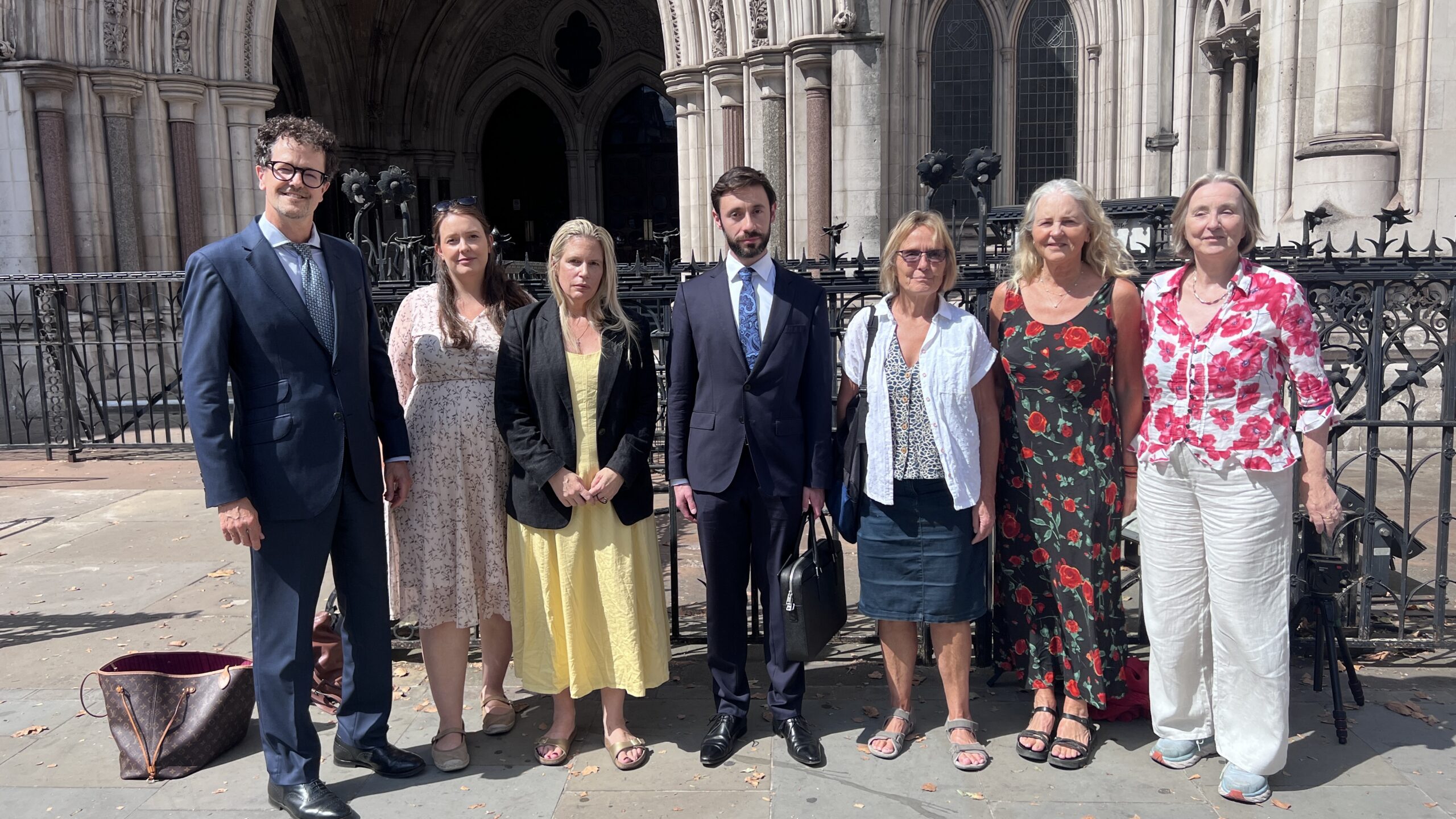 James Esses (centre) and supporters outside the Royal Courts of Justice after the judgment