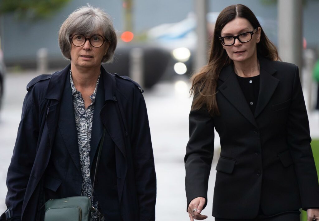 Patricia Marquis walking to court with Jo Galbraith-Marten (r)